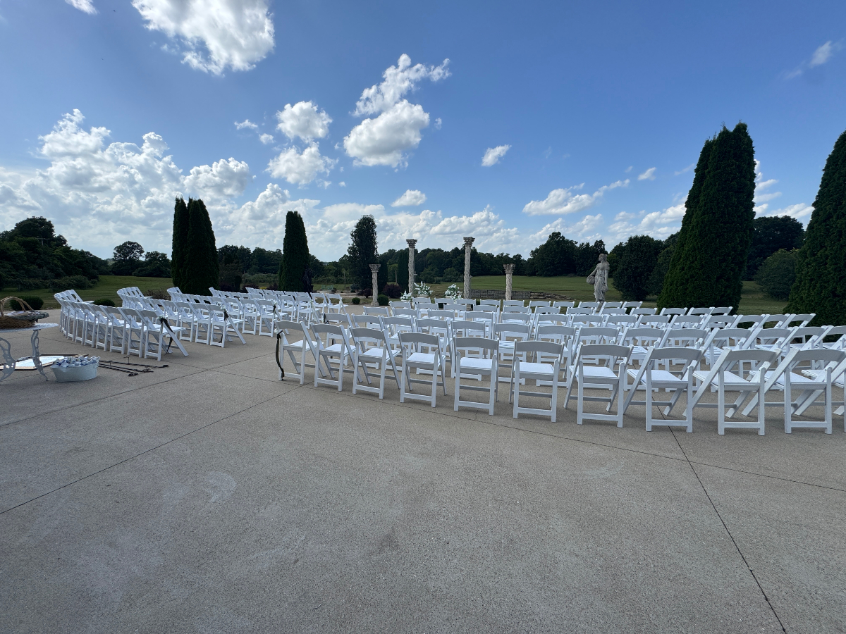 Beautiful wedding ceremony setup with scenic vineyard backdrop